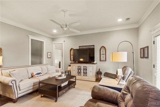 living room with ceiling fan and crown molding