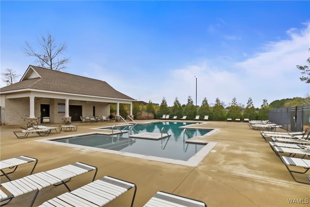 view of swimming pool with a patio area