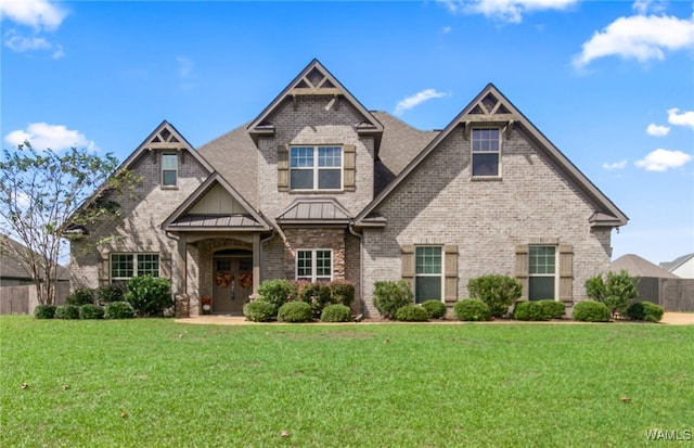 craftsman-style house featuring a front yard