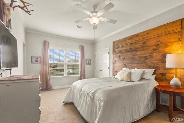 bedroom with light carpet, ceiling fan, and crown molding