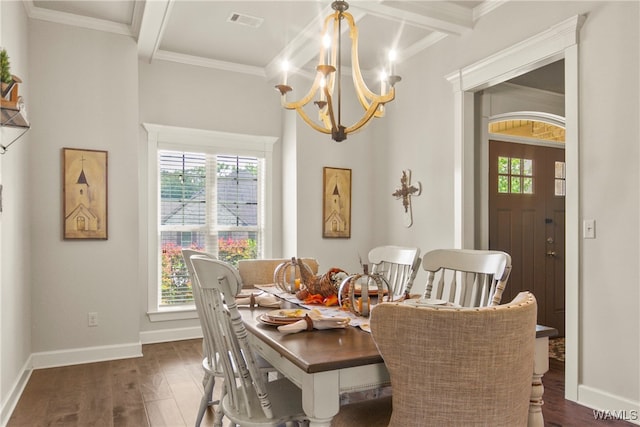 dining area featuring beam ceiling, a wealth of natural light, dark hardwood / wood-style floors, and a notable chandelier