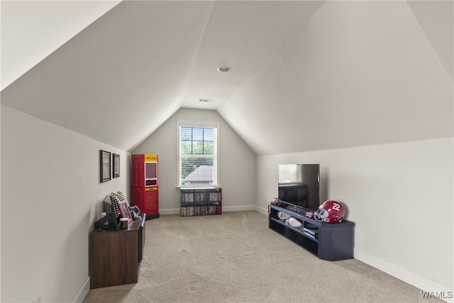 bonus room featuring light colored carpet and vaulted ceiling