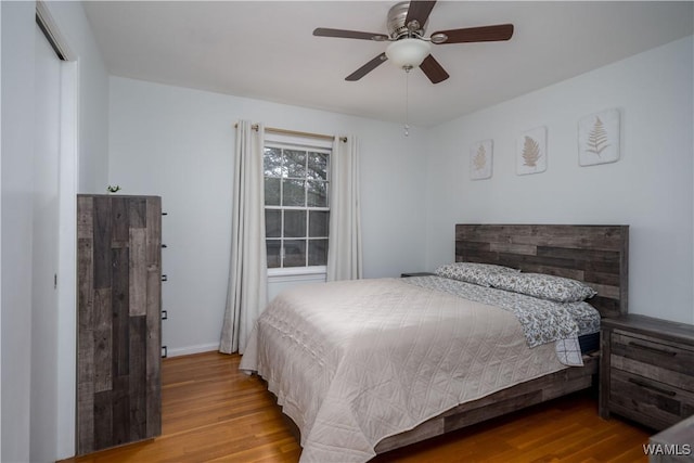 bedroom featuring ceiling fan and light hardwood / wood-style flooring