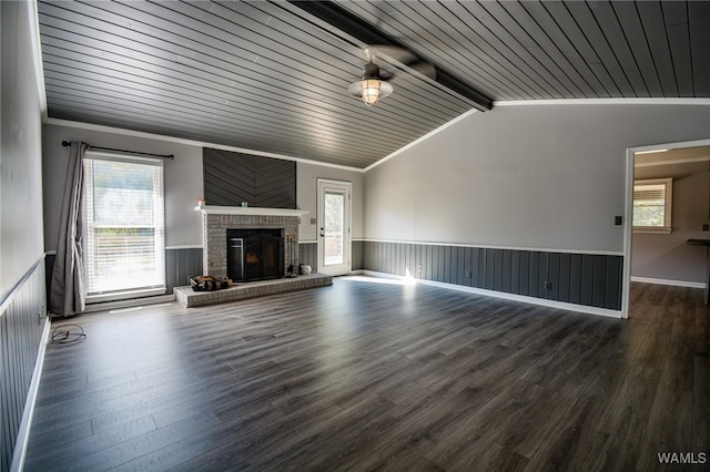 unfurnished living room with dark hardwood / wood-style flooring and a healthy amount of sunlight