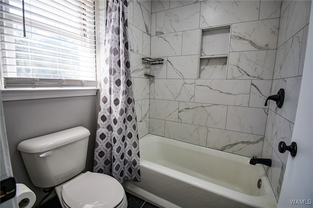 bathroom with shower / bath combination with curtain and toilet