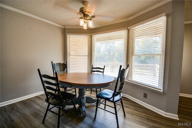 dining area featuring a textured ceiling, dark hardwood / wood-style floors, ceiling fan, and crown molding