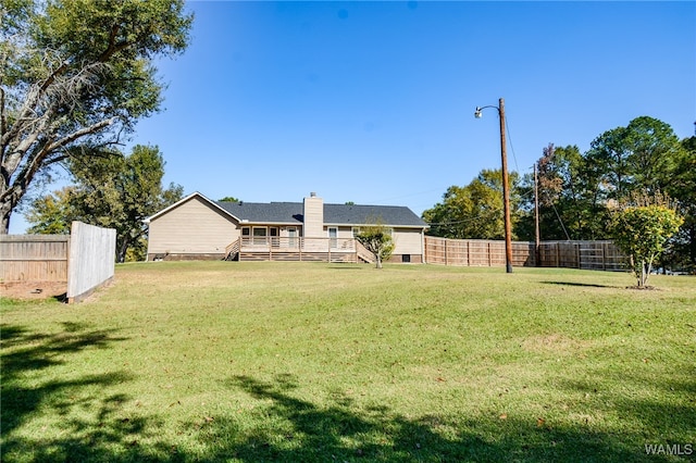 view of yard with a wooden deck