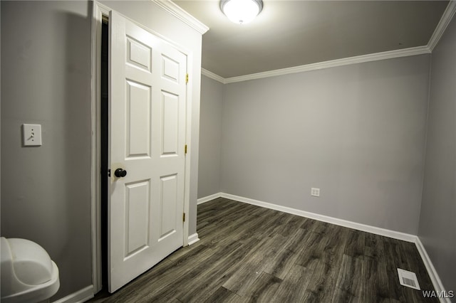 interior space featuring crown molding and dark wood-type flooring