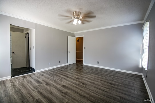 spare room featuring a textured ceiling, dark hardwood / wood-style floors, ceiling fan, and crown molding