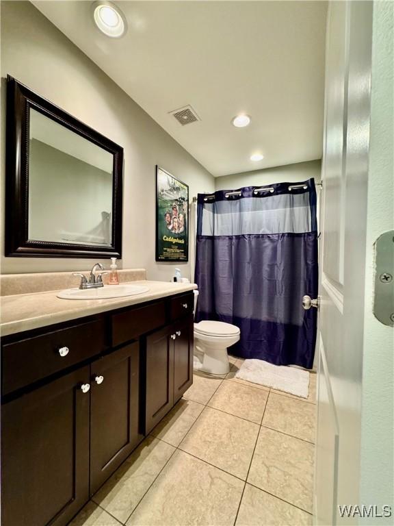 6643 Cooperstown Cir, Tuscaloosa, AL 35453 - bathroom featuring tile patterned flooring, toilet, vanity, curtained shower, and recessed lighting