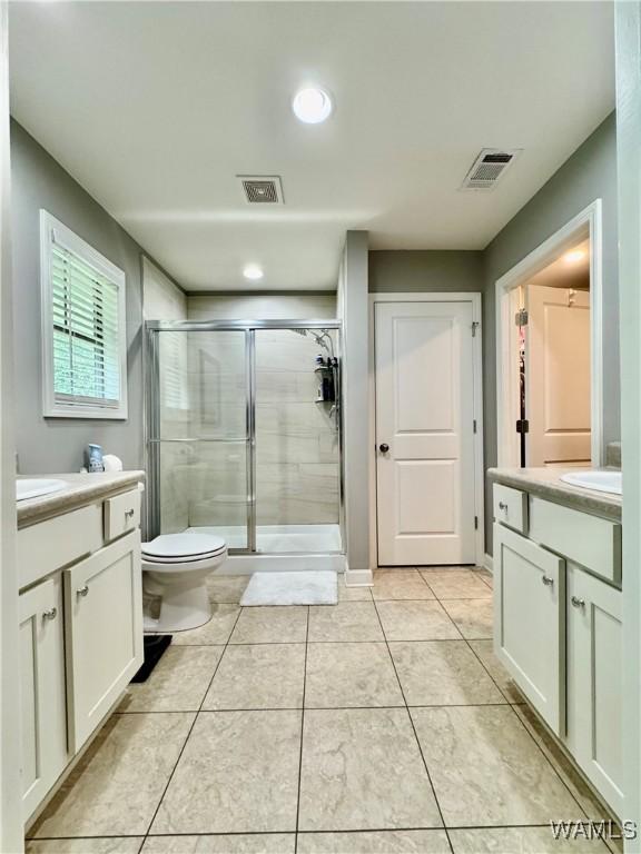 6643 Cooperstown Cir, Tuscaloosa, AL 35453 - full bath with vanity, a stall shower, tile patterned flooring, toilet, and recessed lighting
