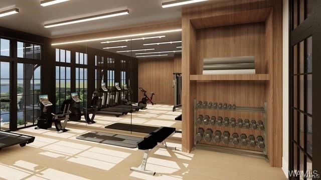 gym featuring wood walls