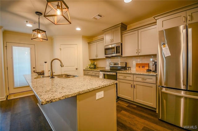 kitchen featuring appliances with stainless steel finishes, visible vents, decorative backsplash, and dark wood-style floors