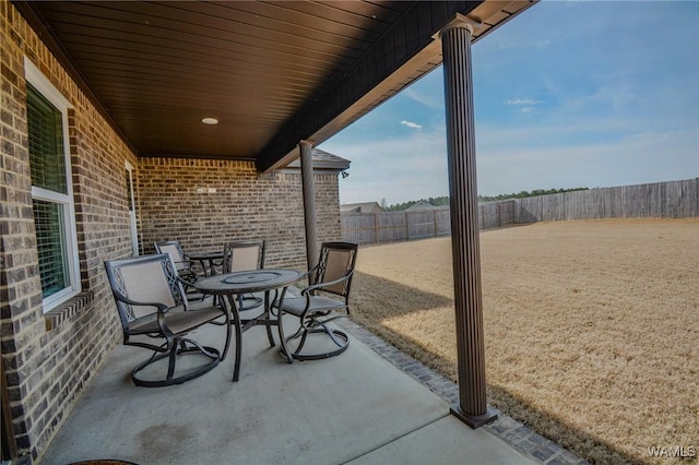 view of patio / terrace with outdoor dining space and a fenced backyard