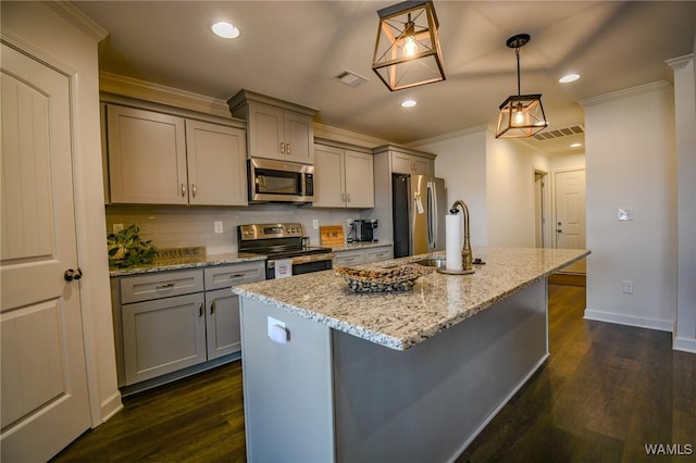 kitchen with appliances with stainless steel finishes, gray cabinets, visible vents, and crown molding