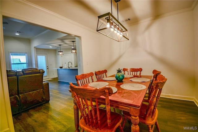 dining area featuring baseboards, visible vents, ornamental molding, and dark wood-type flooring