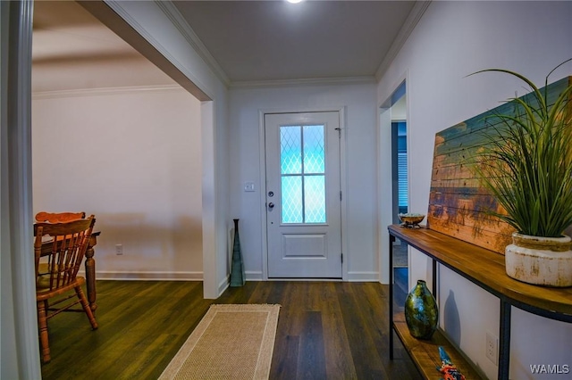 entryway featuring ornamental molding, wood finished floors, and baseboards