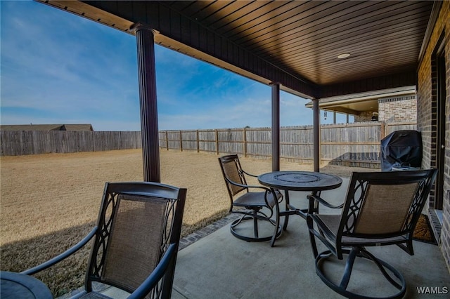 view of patio with a fenced backyard and grilling area