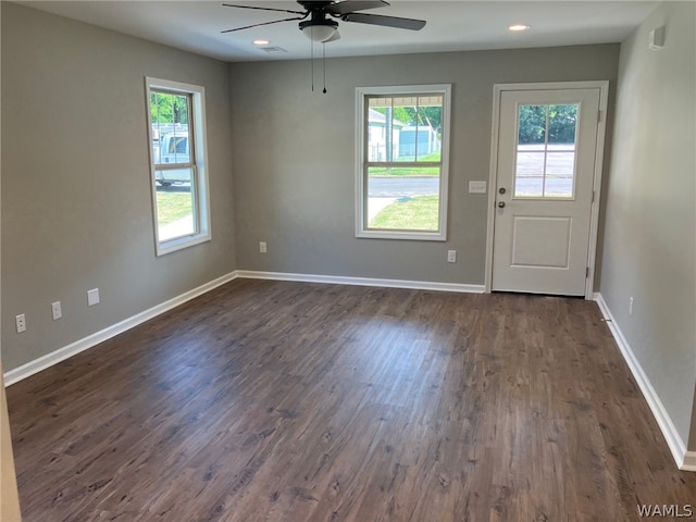 interior space featuring ceiling fan and dark wood-type flooring