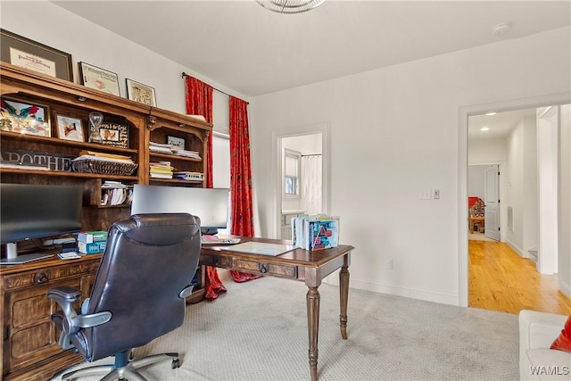 office area with carpet flooring and baseboards