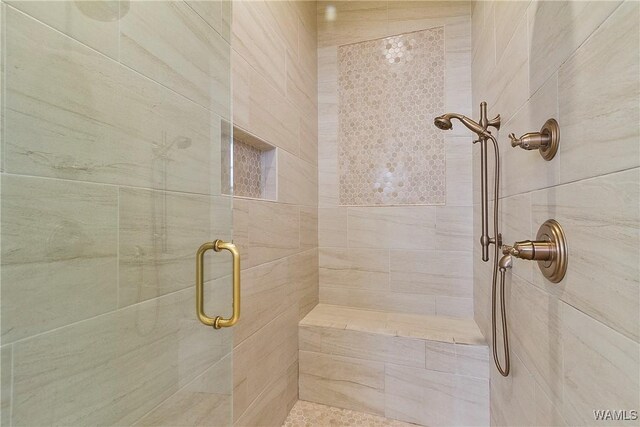 full bath with a shower stall