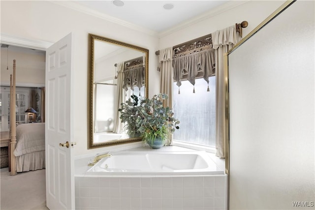 ensuite bathroom featuring crown molding, a garden tub, and connected bathroom