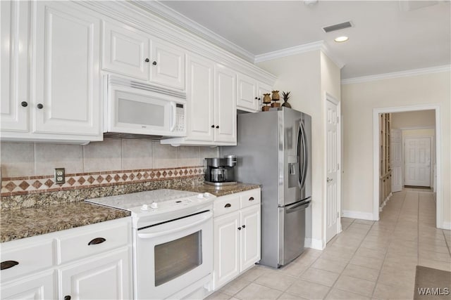 kitchen with white appliances, white cabinetry, visible vents, tasteful backsplash, and crown molding