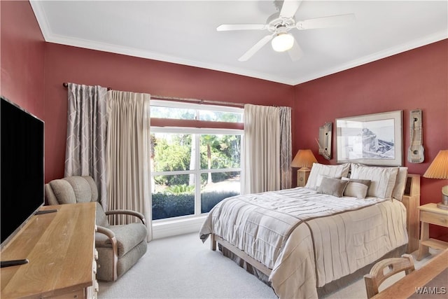 carpeted bedroom with ceiling fan and ornamental molding