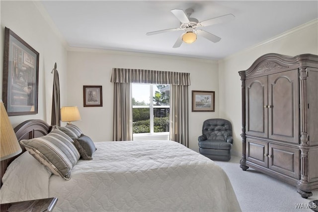 bedroom with carpet, ornamental molding, and a ceiling fan