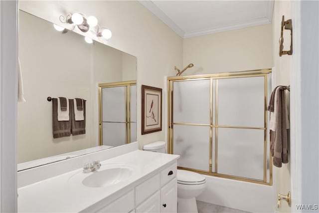 bathroom with enclosed tub / shower combo, ornamental molding, vanity, and toilet