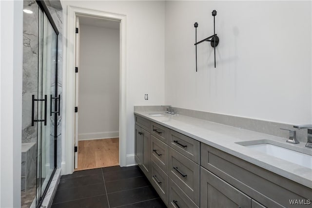 1300 Paul W Bryant Dr Unit 100, Tuscaloosa, AL 35401 - full bath with a marble finish shower, double vanity, and tile patterned flooring