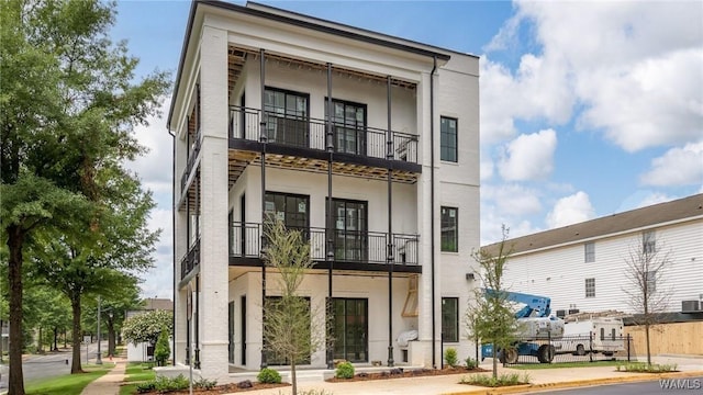 1300 Paul W Bryant Dr Unit 100, Tuscaloosa, AL 35401 - view of front of property featuring a balcony and stucco siding