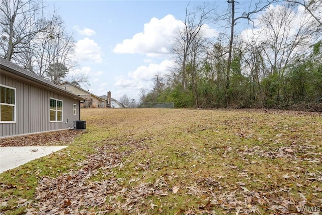 view of yard with cooling unit and a patio area