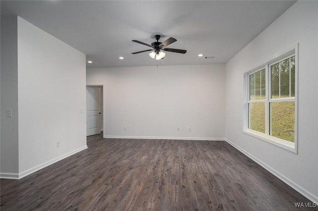 spare room with ceiling fan and dark hardwood / wood-style flooring