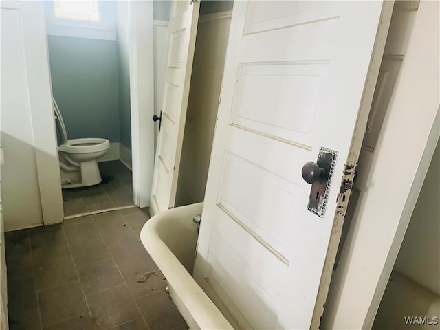 bathroom with a bathtub and toilet