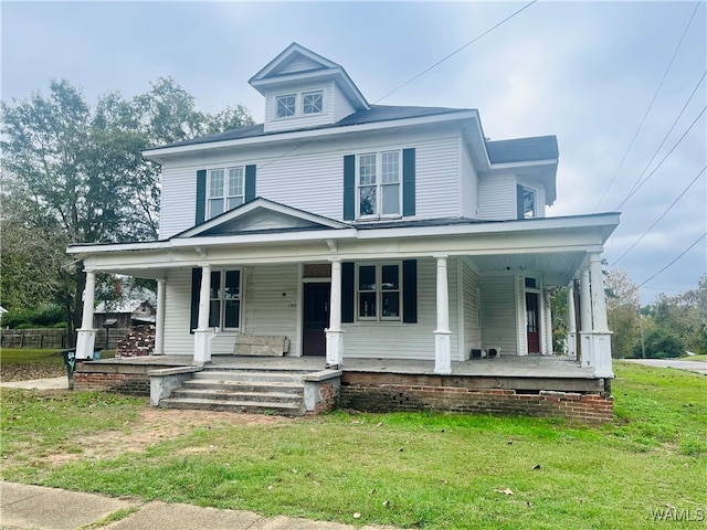 view of front of property with a front yard and covered porch