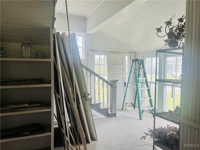 interior space featuring wood-type flooring and lofted ceiling