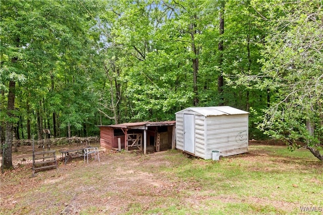 10463 Beulah Lake Ln, Cottondale, AL 35453 - view of shed featuring a view of trees