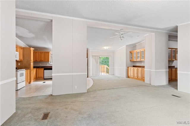 10463 Beulah Lake Ln, Cottondale, AL 35453 - unfurnished living room with light colored carpet, a ceiling fan, ornamental molding, lofted ceiling, and a textured ceiling