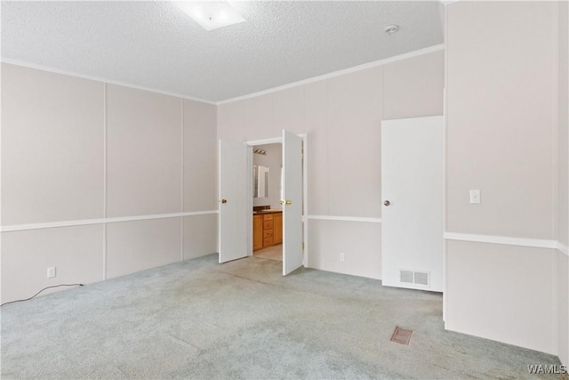 10463 Beulah Lake Ln, Cottondale, AL 35453 - carpeted empty room featuring ornamental molding and a textured ceiling