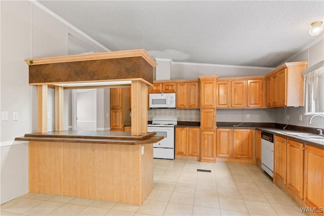 10463 Beulah Lake Ln, Cottondale, AL 35453 - kitchen featuring white appliances, lofted ceiling, dark countertops, a sink, and a textured ceiling
