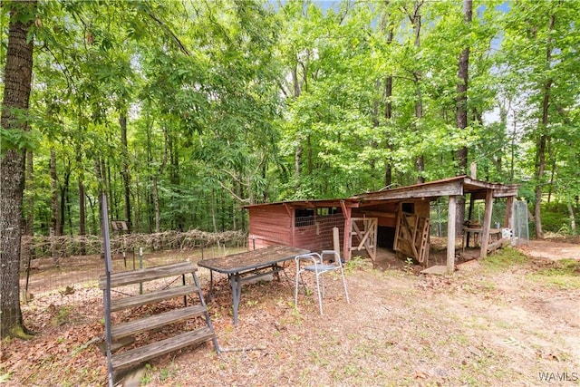 10463 Beulah Lake Ln, Cottondale, AL 35453 - view of outdoor structure with an outdoor structure and a wooded view