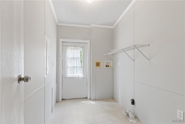 10463 Beulah Lake Ln, Cottondale, AL 35453 - clothes washing area featuring ornamental molding, a textured ceiling, hookup for a washing machine, and light tile patterned floors