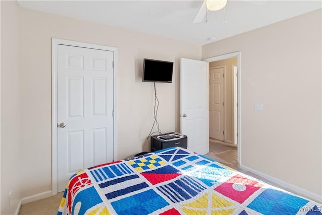 carpeted bedroom featuring ceiling fan