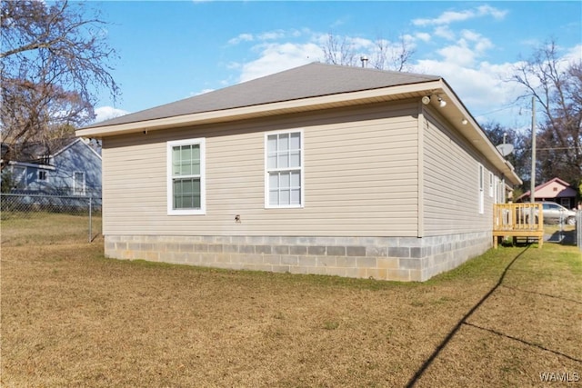 view of home's exterior with a lawn