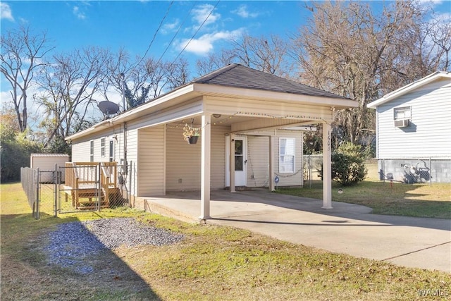 view of front facade with a carport and a front yard