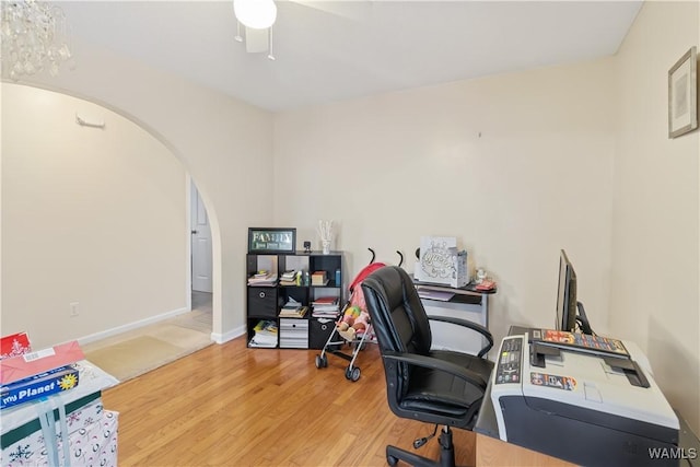 home office with ceiling fan and light wood-type flooring