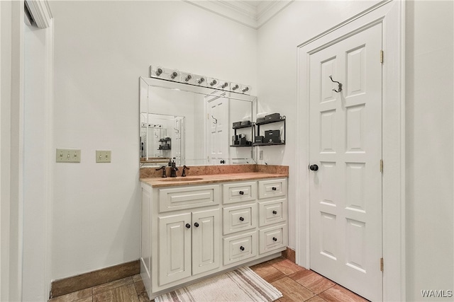 bathroom with wood-type flooring, vanity, and ornamental molding