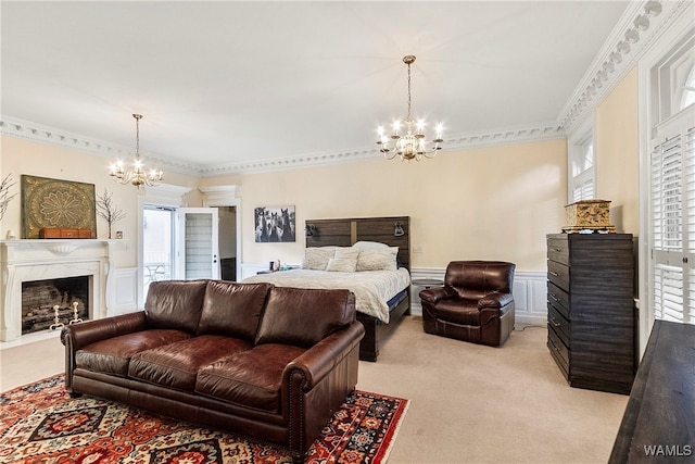 bedroom featuring crown molding, a fireplace, light carpet, and an inviting chandelier