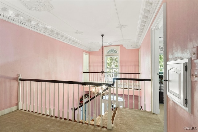 corridor with carpet flooring and ornamental molding